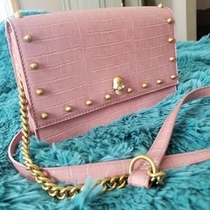 Pink crossbody with skull and gold studs